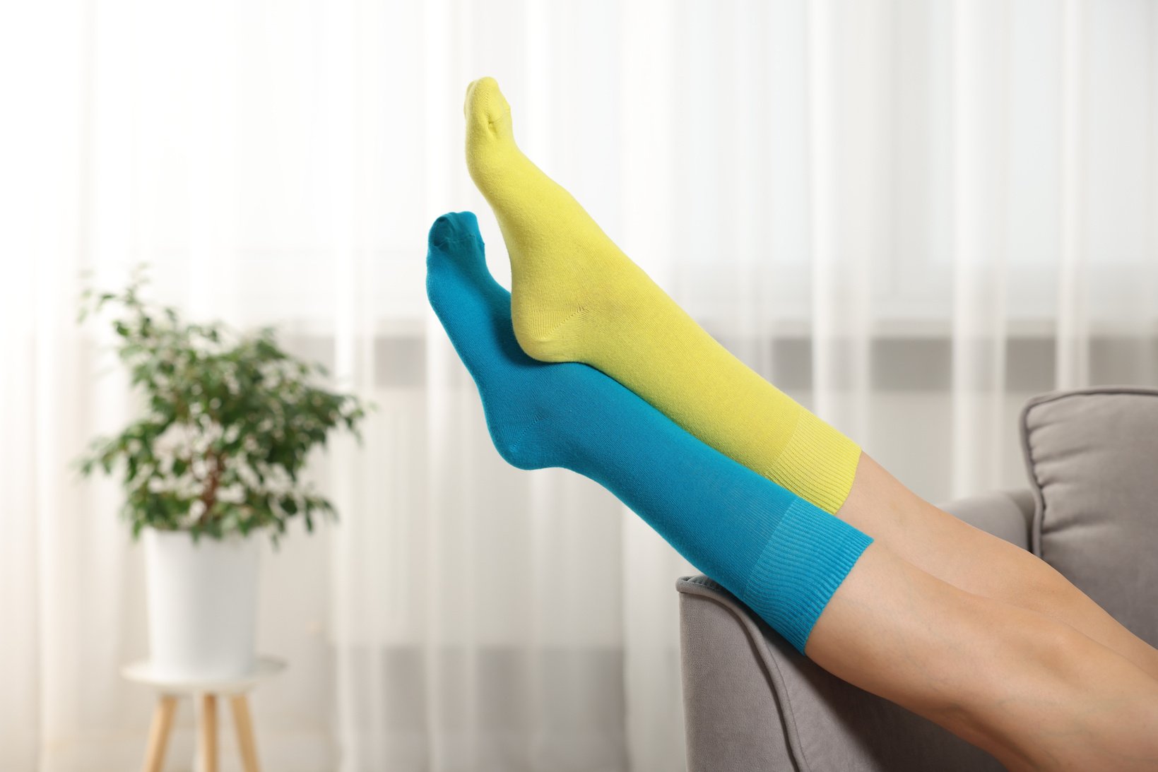 Woman in Different Stylish Socks Indoors, Closeup